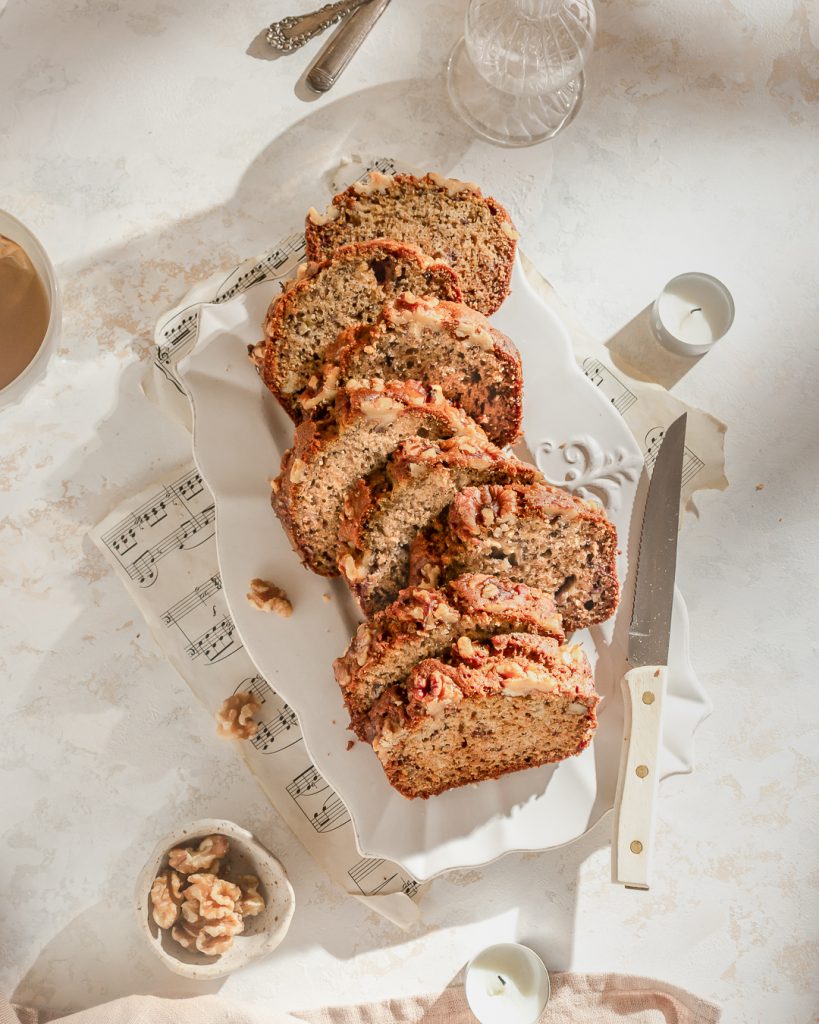 deliciously moist banana bread with walnuts sliced