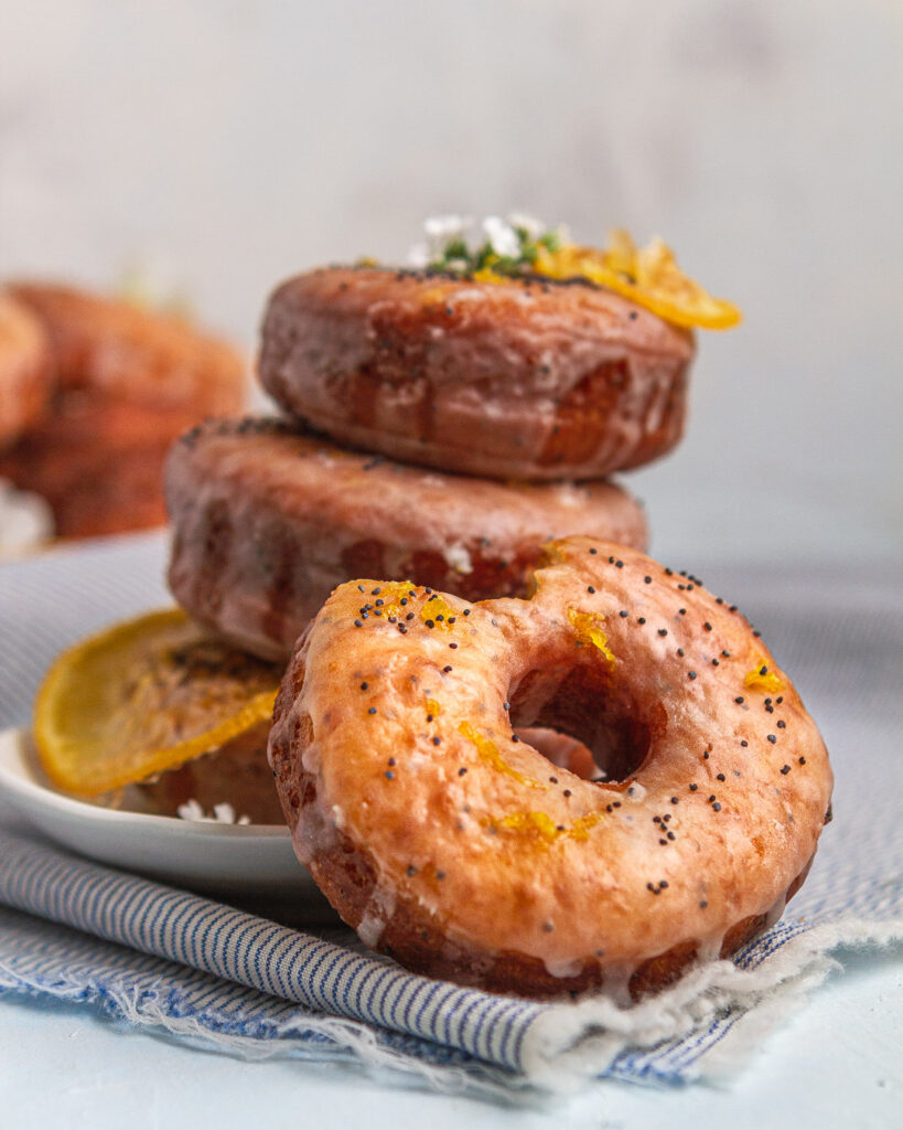 a stack of lemon poppy seed donuts