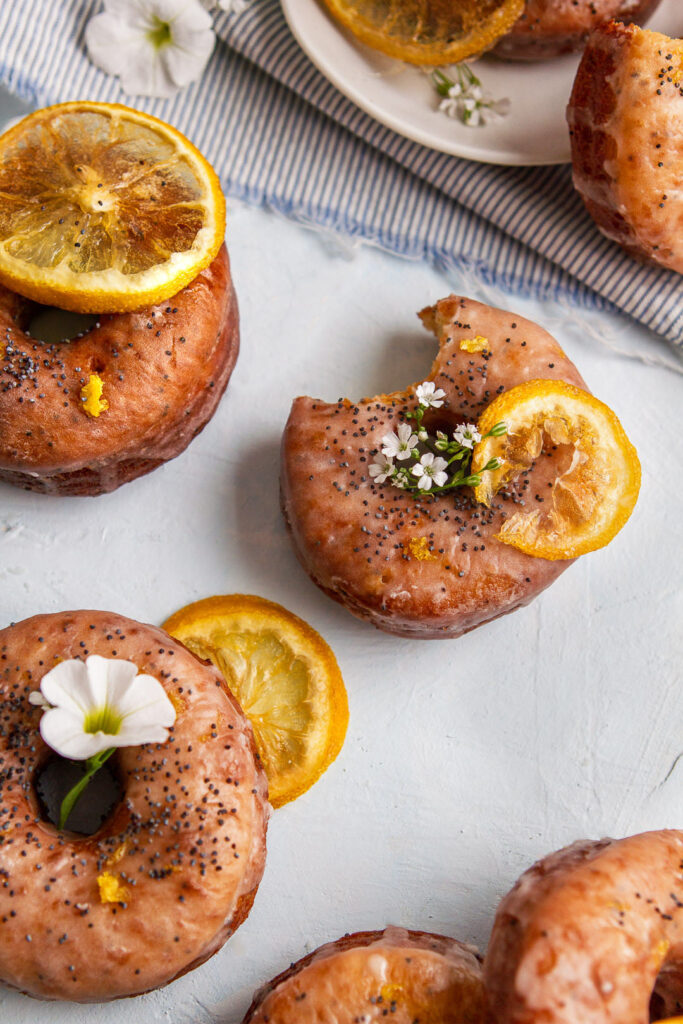 lemon poppy seed donuts with a bite taken out