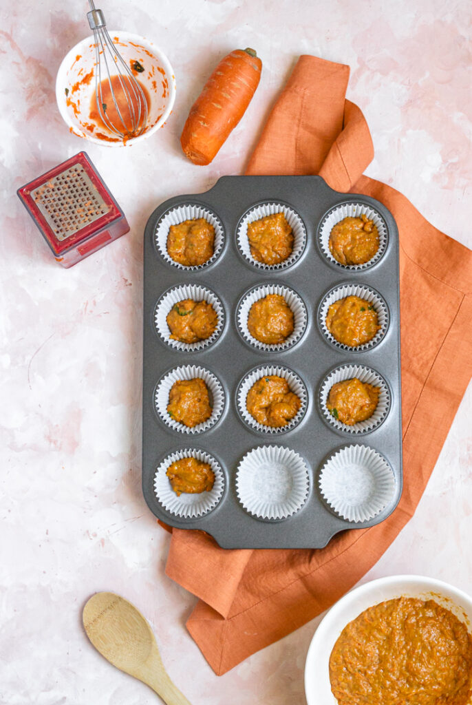 a muffin pan waiting to be baked