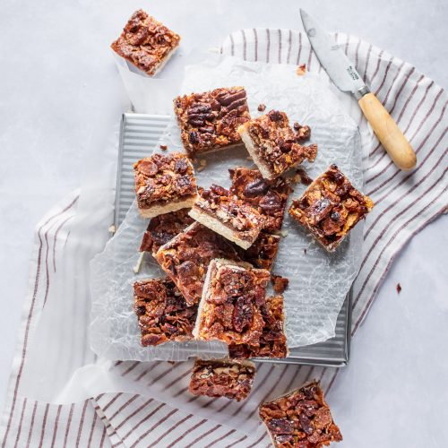 Pecan pie bars cut and waiting to be served