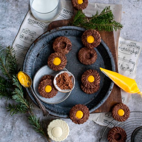 Chocolate Lemon Curd Linzer Cookies being filled