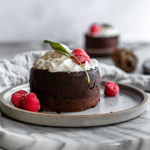 Chocolate Lava Cake with raspberries, and whipped cream