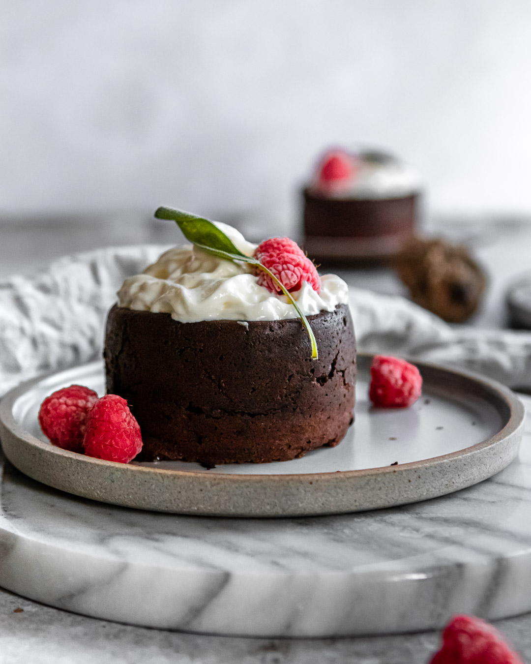 Chocolate Lava Cake with raspberries, and whipped cream