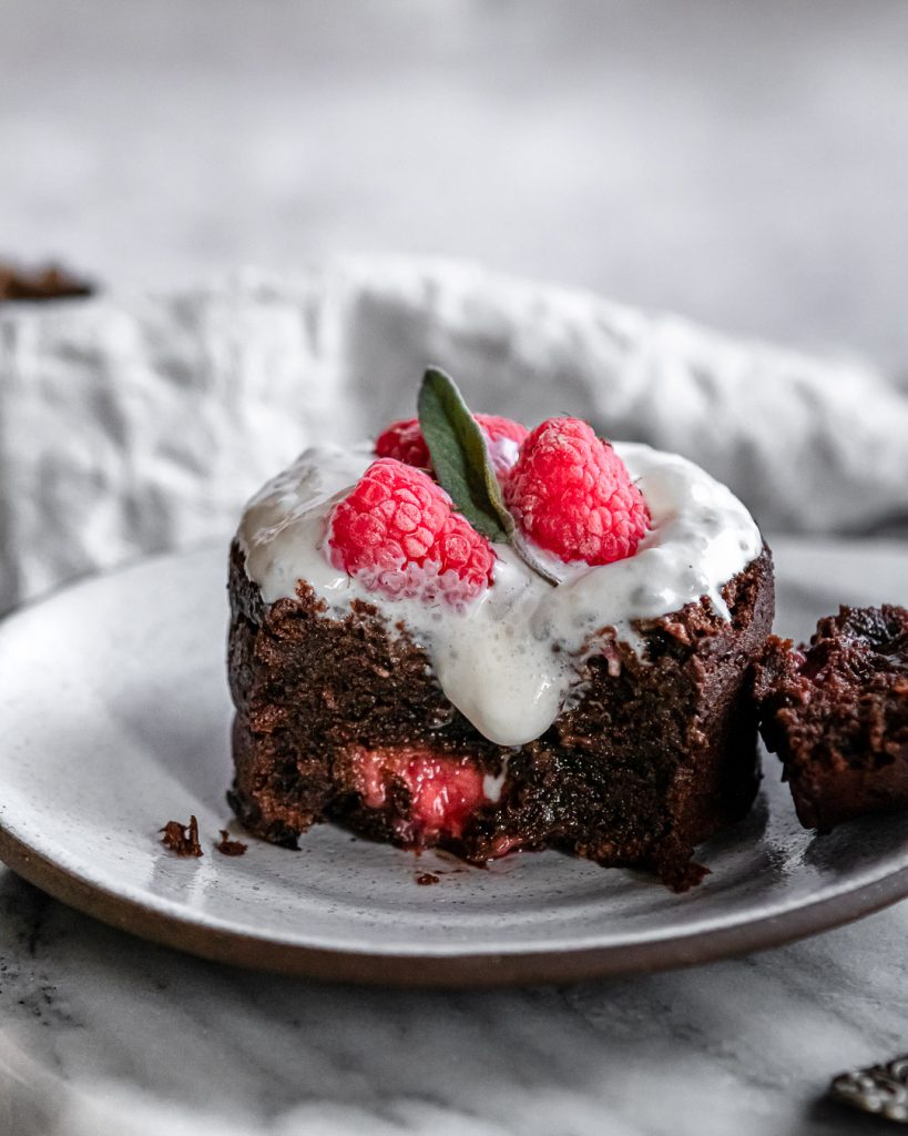 molton chocolate raspberry lava cake with dripping whipped cream