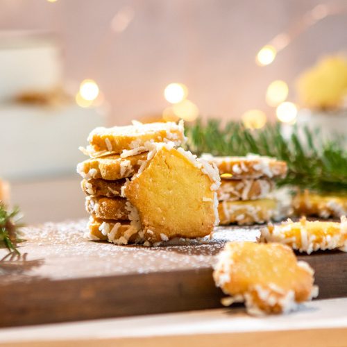 star cookies stacked in front of a lit background