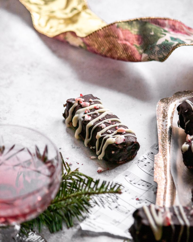 close up of a twix bar with wine and festive decor