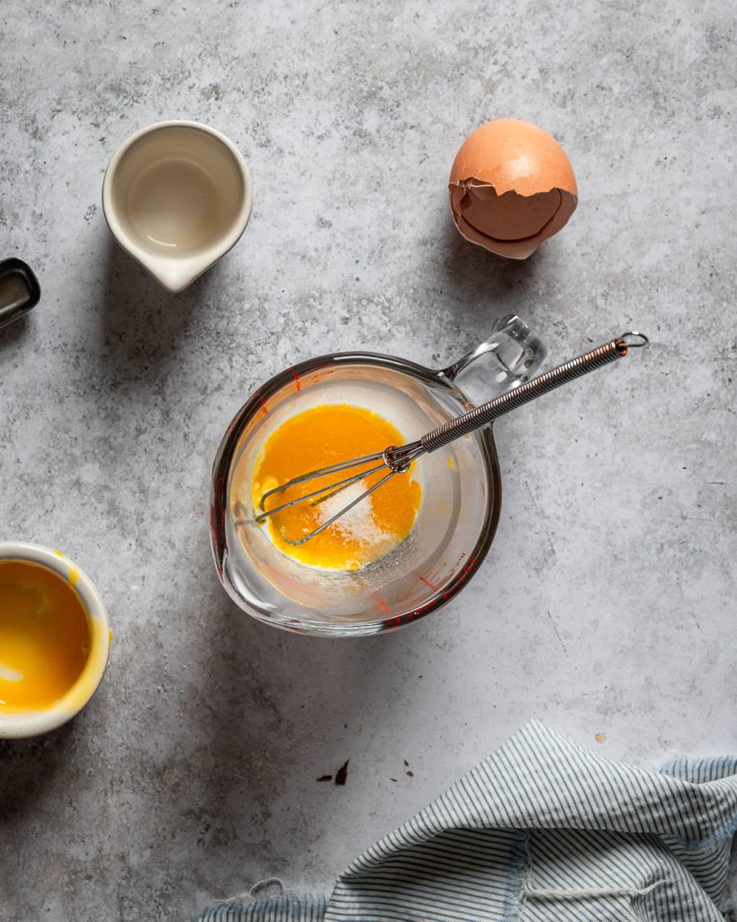 Whisking eggs in a pitcher