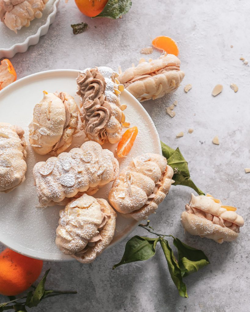 Clementine mocha meringue sandwich cookies served on a platter