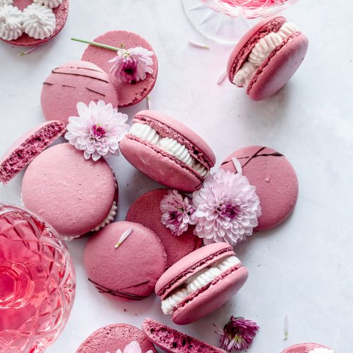 red wine macarons with purple flowers