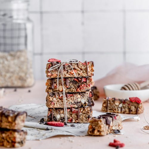 Strawberry Banana granola bars stacked and tied with a bow