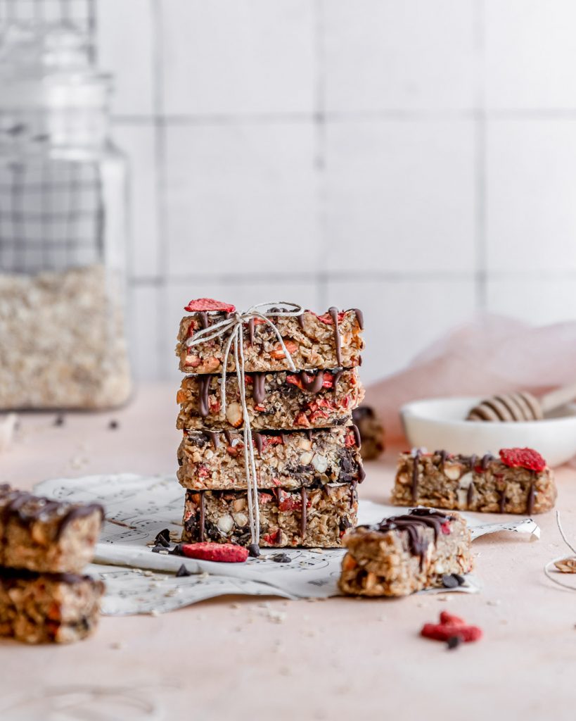 Strawberry Banana granola bars stacked and tied with a bow