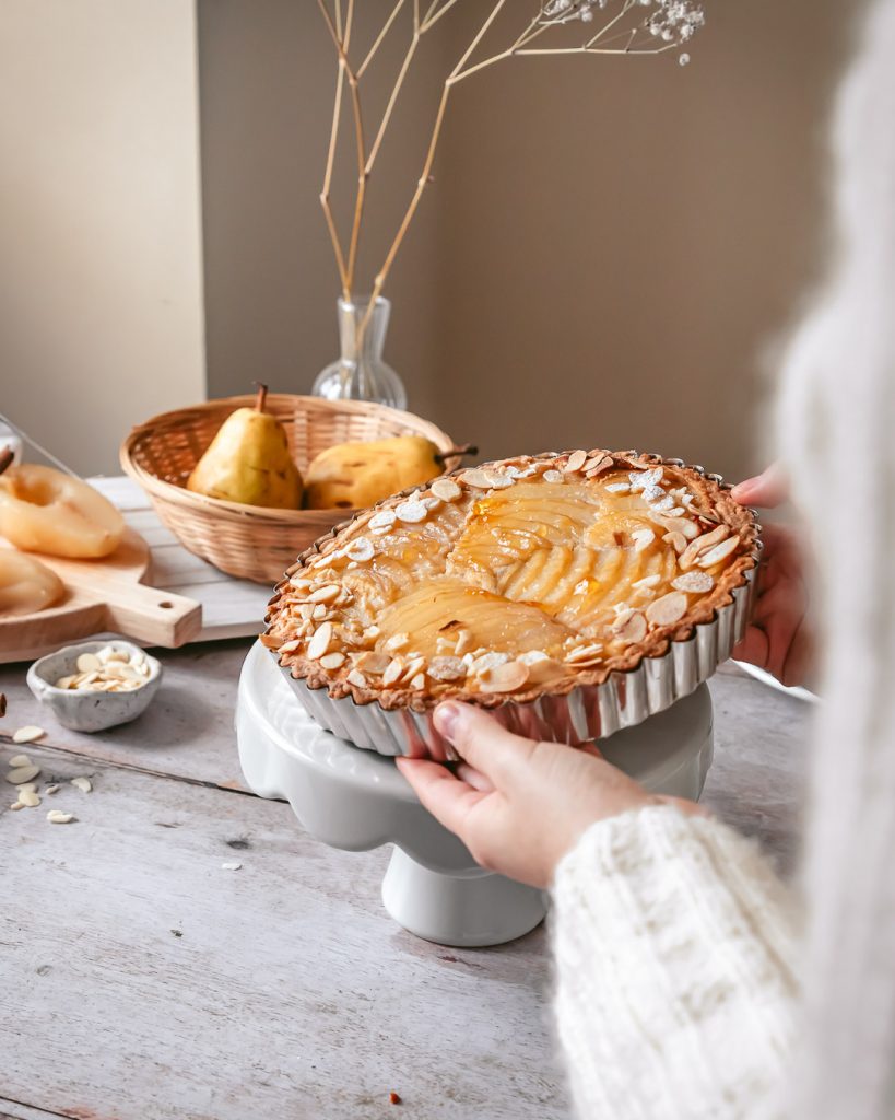 serving a hot tart onto a cake stand