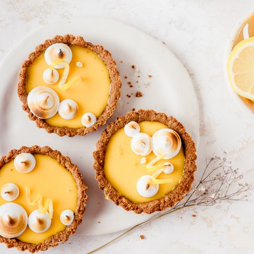 Close up of yuzu lemon tarts with meringue