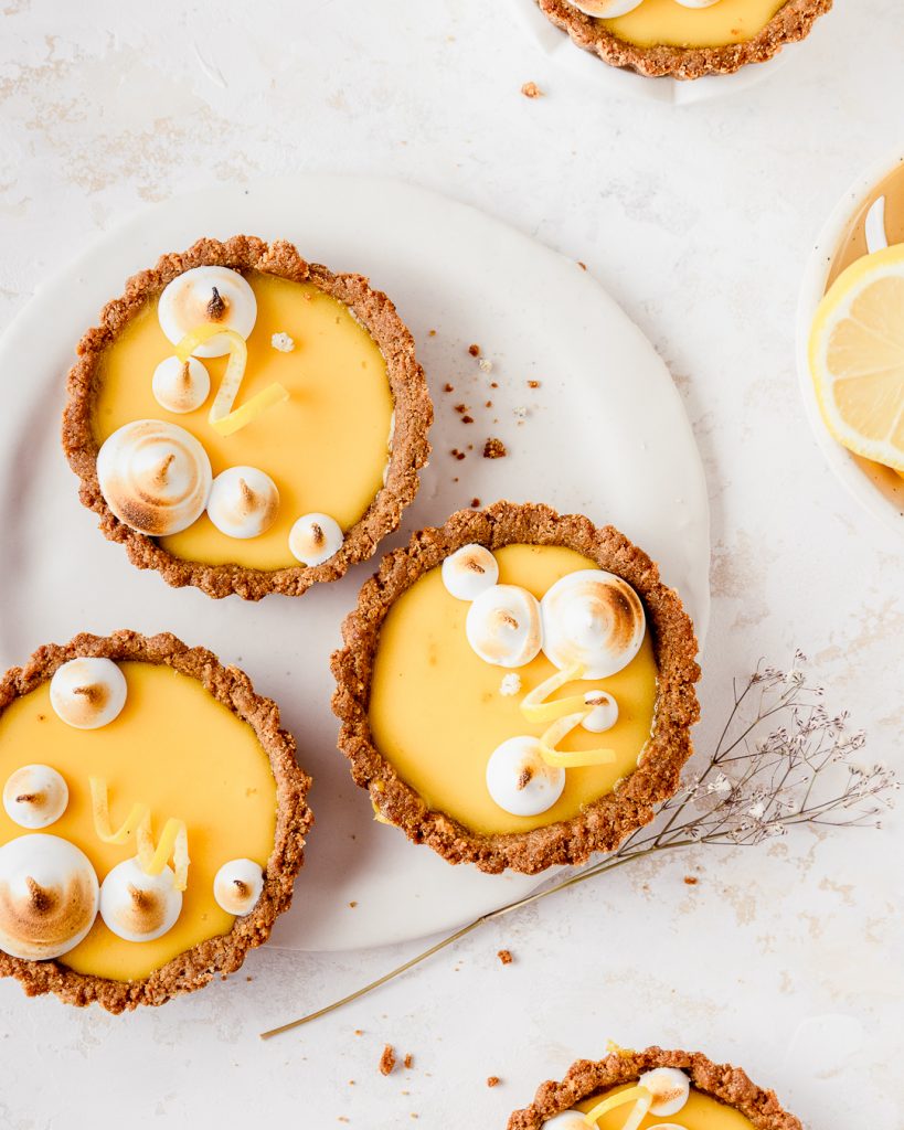 Close up of yuzu lemon tarts with meringue