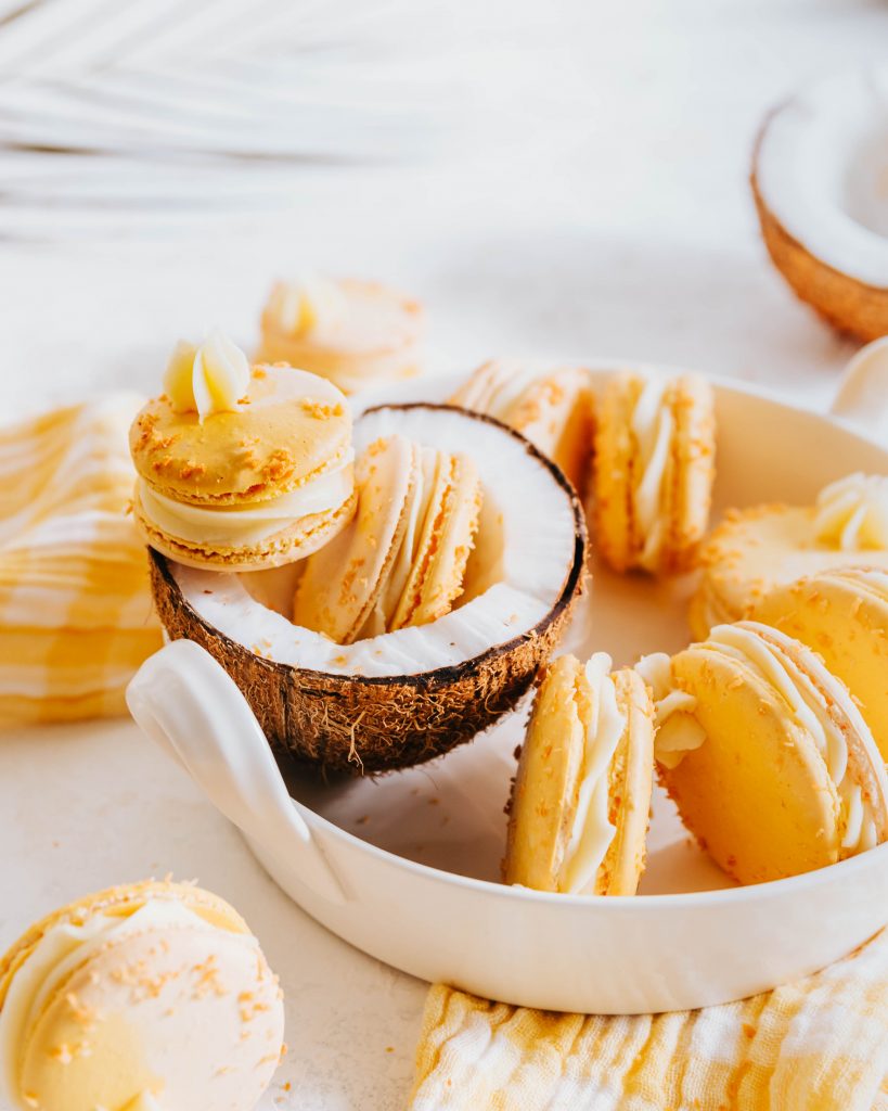 Mango Toasted Coconut Macarons in a Coconut Husk